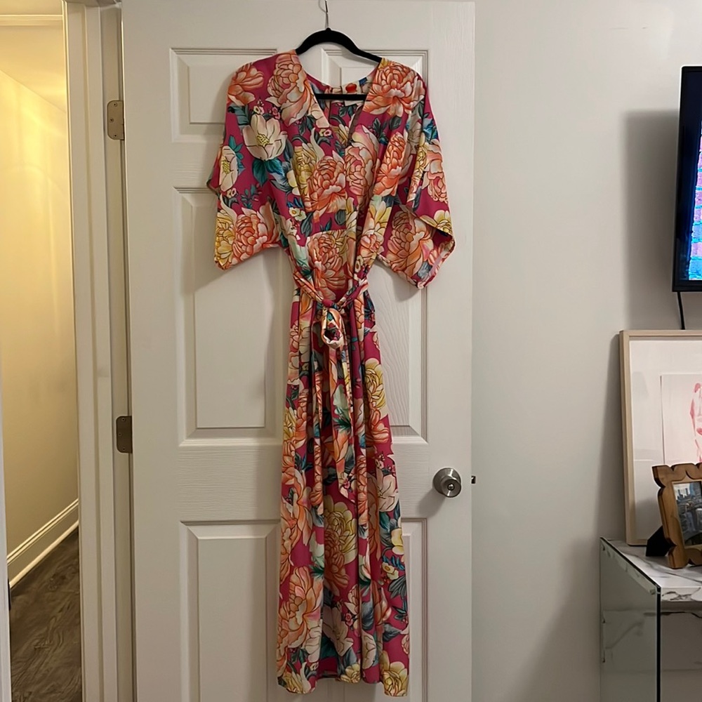 Floral Anthropologie jumpsuit with wide legs and waist bow